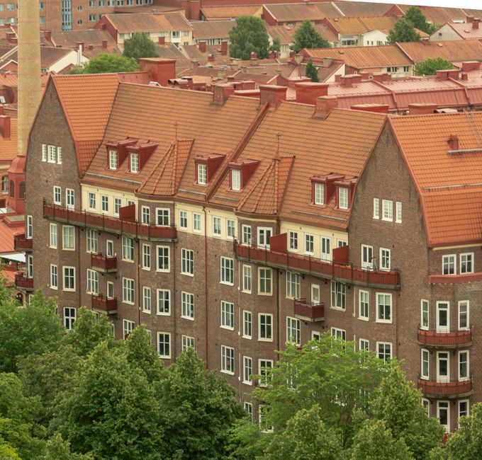 Traditional brick residential building with detailed roofline and quality exterior