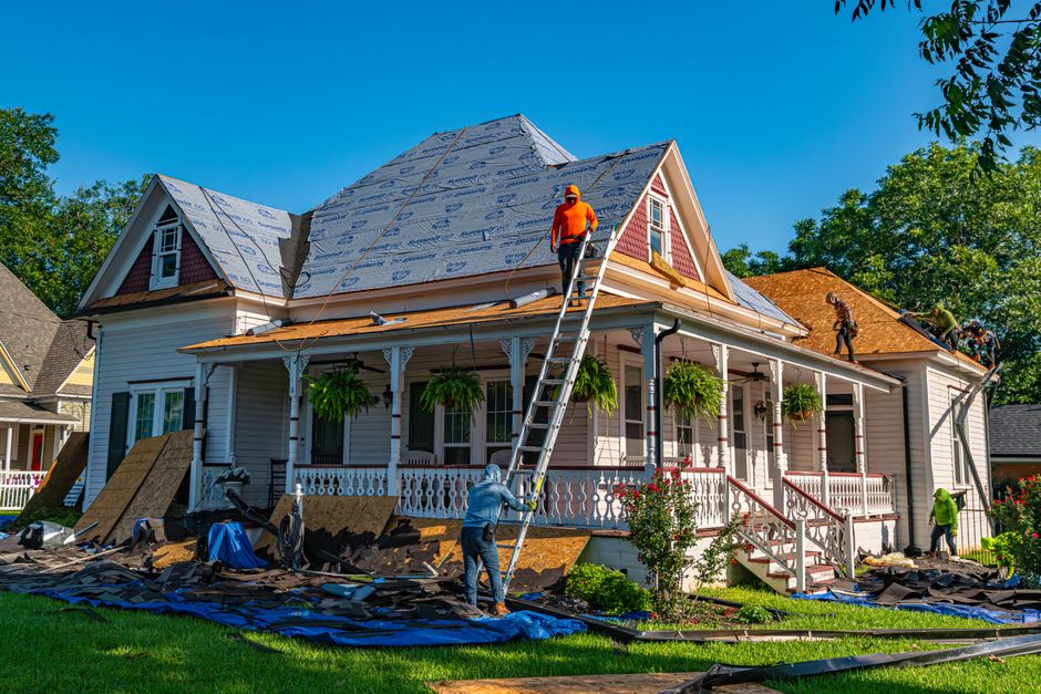 Historic home roof replacement in progress with new shingles